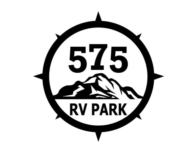 Logo for "575 RV Park" featuring a mountain graphic within a compass circle.